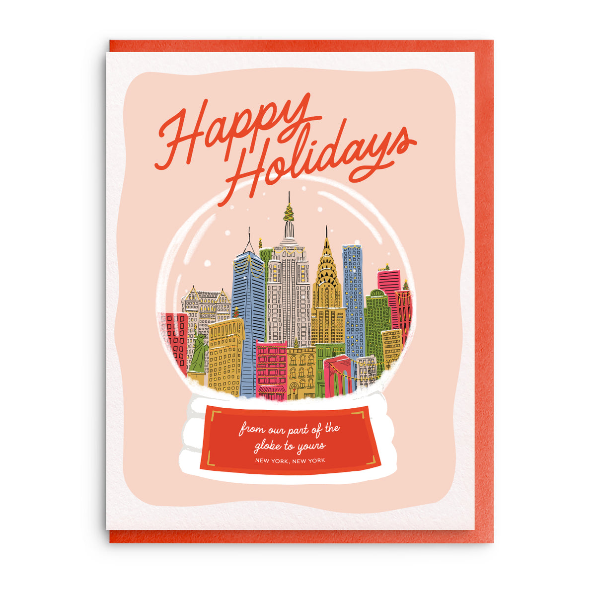 Illustration of a snow globe holding a colorful New York City skyline, with the words Happy Holidays in gold above, on a coral background card.